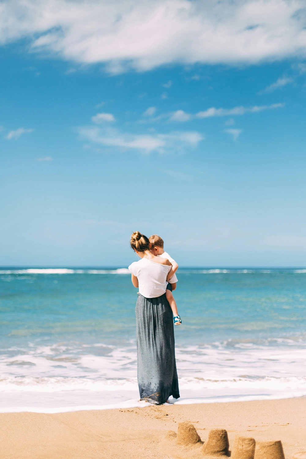 vestaria, mutter und kind am strand